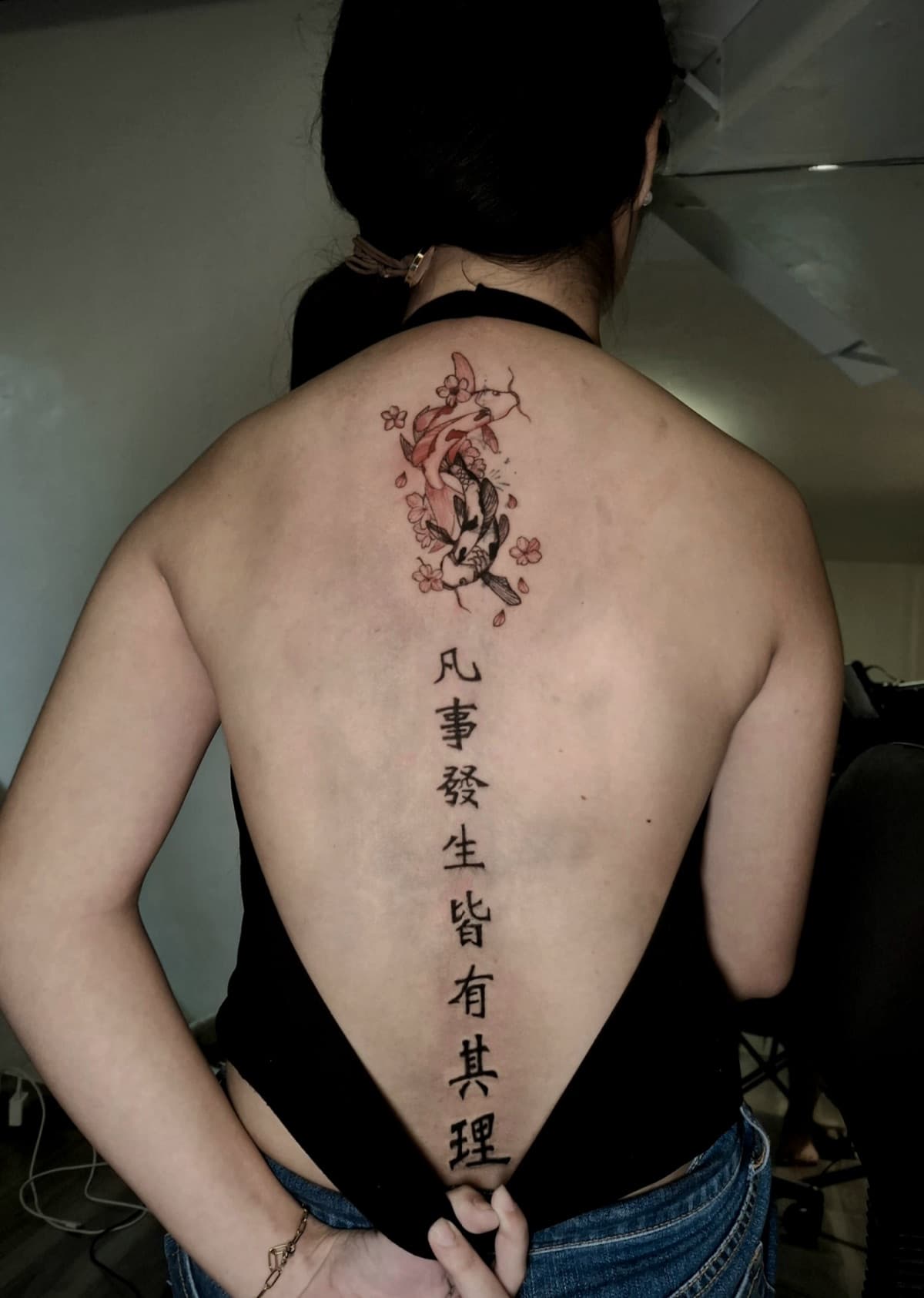 japanese koi fish and kanji script spine tattoo by isaiah recongco — gorillaz tattoo art studio philippines